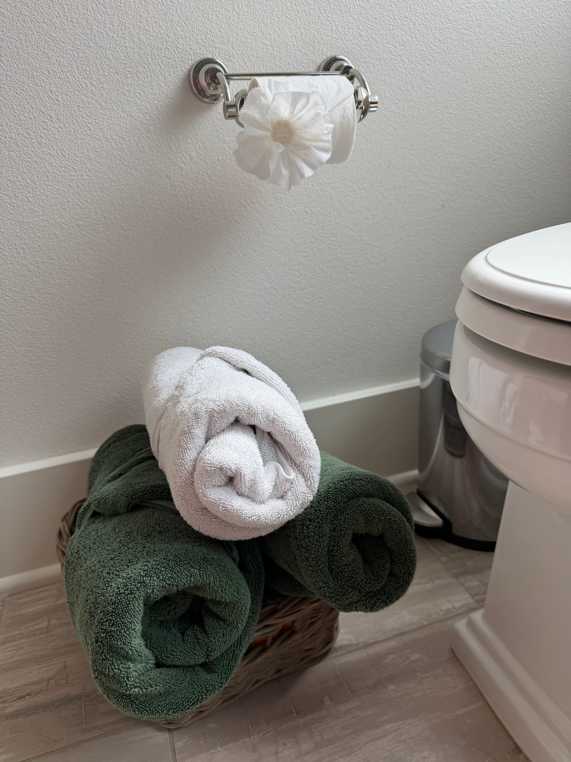 Neatly rolled towels in a basket after cleaning